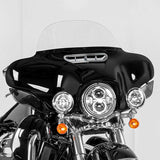 Black touring motorcycle front fairing with LED headlight, windshield, and chrome accents