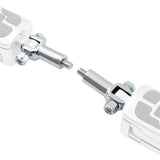 Close-up of adjustable chrome hinge connector with bolts and threaded ends on white background