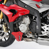 Close-up of a red sport motorcycle engine, gold suspension, and exposed mechanical parts