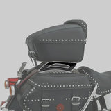 Black leather motorcycle saddlebag and trunk with chrome studs on a cruiser bike