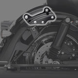 Close-up of Harley Davidson motorcycle saddlebag bracket and rear wheel.