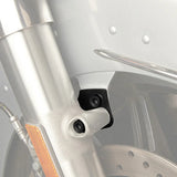 Close-up of motorcycle fork with black fork leg cover and disc brake detail