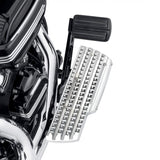 Chrome motorcycle footboard with black rubber brake pedal on custom engine