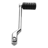 Chrome motorcycle gear shift lever with black rubber pedal, isolated on white background