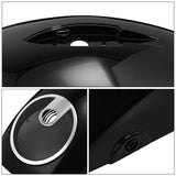 Glossy black motorcycle gas tank with chrome fuel cap and built-in speaker grille detail.