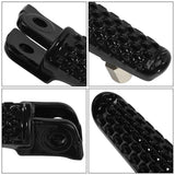 Close-up of black metal motorcycle foot pegs with textured non-slip surface and mounting holes