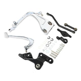 Chrome and black motorcycle brake pedal assembly kit with bolts and washers on white background