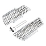 Silver motorcycle foot pegs with hardware, serrated grip design, on white background