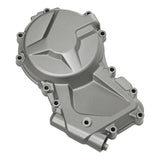 Silver motorcycle engine cover with bolts on white background