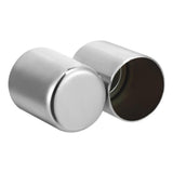 Pair of stainless steel magnetic spice jars with one open, isolated on white background