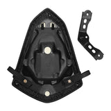 Black motorcycle seat pan with mounting bracket on white background