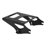 Black metal motorcycle luggage rack with cutout design on white background