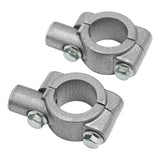 Pair of metal pipe clamps with bolts on white background