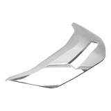 Chrome car headlight trim cover with modern, angular design on white background